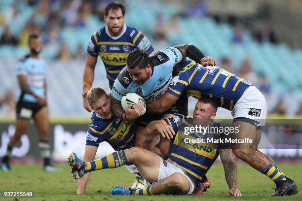 Andrew Fifita of the Sharks is tackled during the round three NRL match between the Parramatta Eels and the Cronulla Sharks at ANZ Stadium on March...