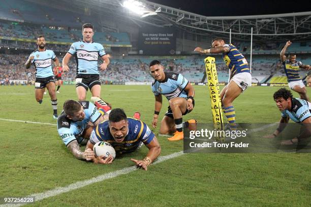 Kirisome AuvaÕa of the Eels scores a try during the round three NRL match between the Parramatta Eels and the Cronulla Sharks at ANZ Stadium on March...