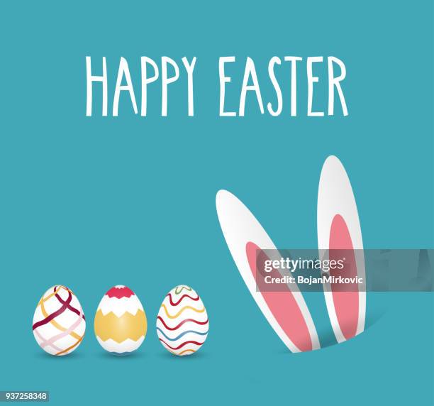 happy easter hand lettering with rabbit ears in hole and eggs. vector illustration. - colorful easter eggs stock illustrations