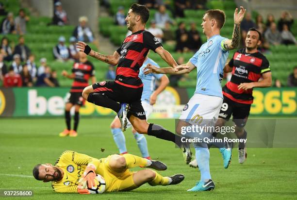 Dean Bouzanis of the City makes a save infront of Alvaro Cejudo of the Wanderers during the round 24 A-League match between Melbourne City and the...