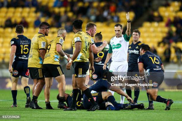 Referee Mike Fraser makes a call during the round six Super Rugby match between the Hurricanes and the Highlanders at Westpac Stadium on March 24,...