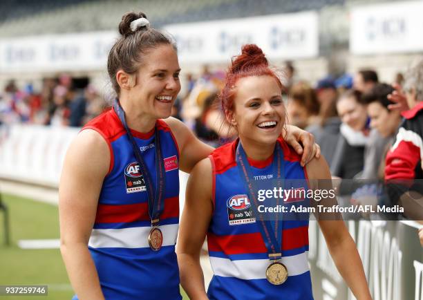 Jenna Bruton of the Bulldogs celebrates with Emma Kearney of the Bulldogs during the 2018 AFLW Grand Final match between the Western Bulldogs and the...