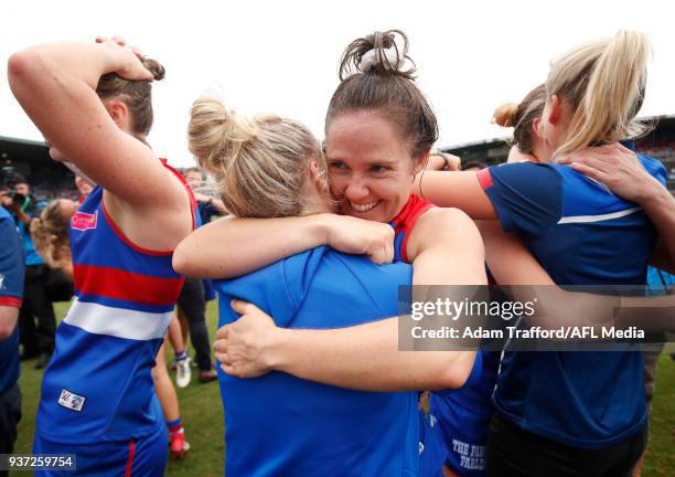 Emma Kearney of the Bulldogs celebrates with Daria Bannister of the Bulldogs during the 2018 AFLW Grand Final match between the Western Bulldogs and...