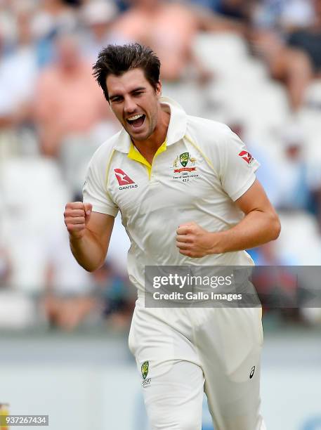 Pat Cummins of Australia celebrates after taking the wicket to dismiss Dean Elgar of South Africa during day 3 of the 3rd Sunfoil Test match between...