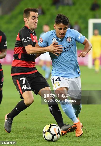 Steven Lustica of the Wanderers and Daniel Arzani of the City compete for the ball during the round 24 A-League match between Melbourne City and the...