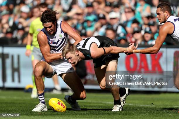 Alex Pearce of the Dockers tackles Todd Marshall of the Power during the 2018 AFL round 01 match between the Port Adelaide Power and the Fremantle...