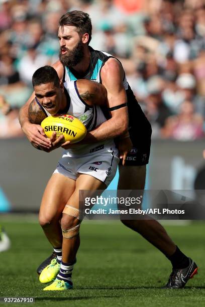 Michael Walters of the Dockers is tackled by Justin Westhoff of the Power during the 2018 AFL round 01 match between the Port Adelaide Power and the...