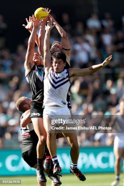 Brad Ebert of the Power competes with Bailey Banfield of the Dockers during the 2018 AFL round 01 match between the Port Adelaide Power and the...