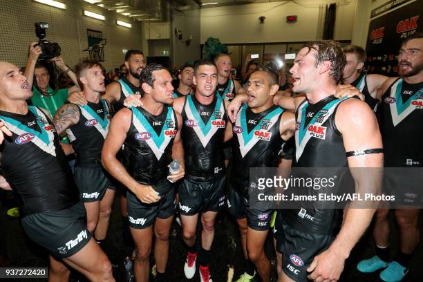 Jack Watts, Steven Motlop, Tom Rockliff and Dom Barry of the Power celebrate their win during the 2018 AFL round 01 match between the Port Adelaide...