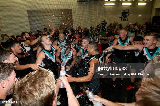 Jack Watts, Steven Motlop, Tom Rockliff and Dom Barry of the Power celebrate their win during the 2018 AFL round 01 match between the Port Adelaide...