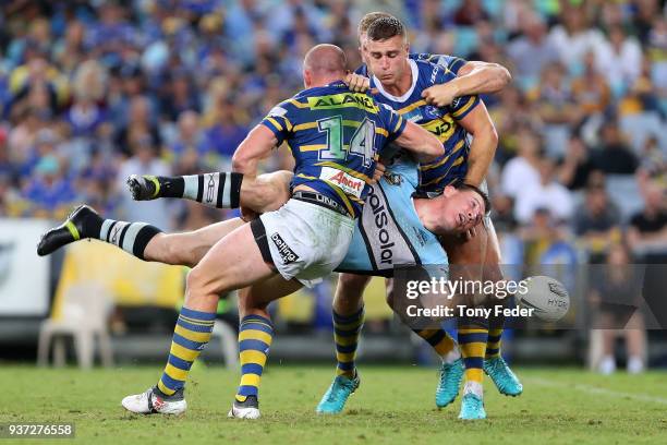 Paul Gallen of the Sharks is tackled during the round three NRL match between the Parramatta Eels and the Cronulla Sharks at ANZ Stadium on March 24,...