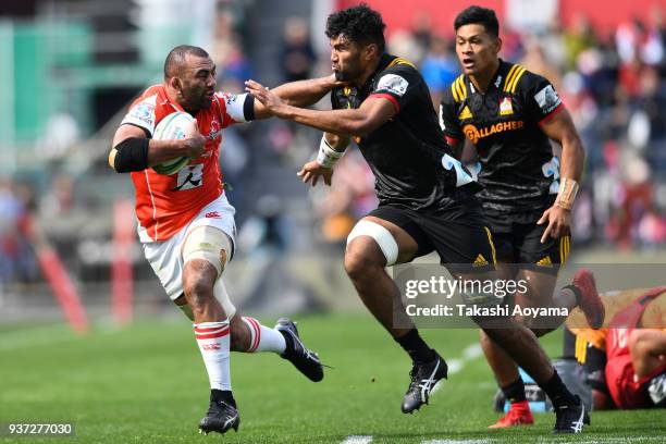 Michael Leitch of the Sunwolves is tackled by Taleni Seu of the Chiefs during the Super Rugby match between Sunwolves and Chiefs at Prince Chichibu...