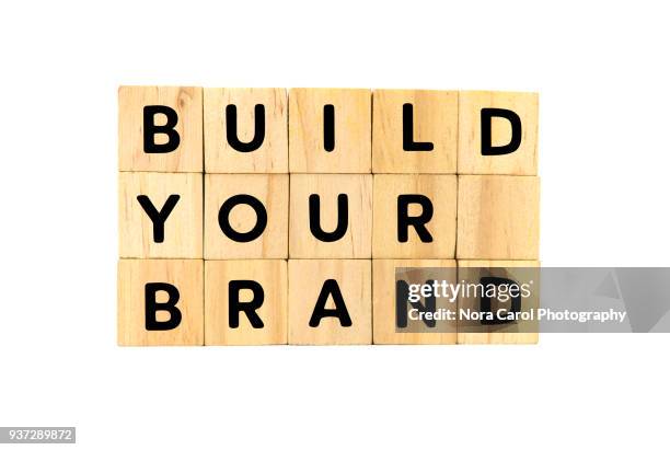 build your brand text on wooden blocks on white background - branding identity stock pictures, royalty-free photos & images