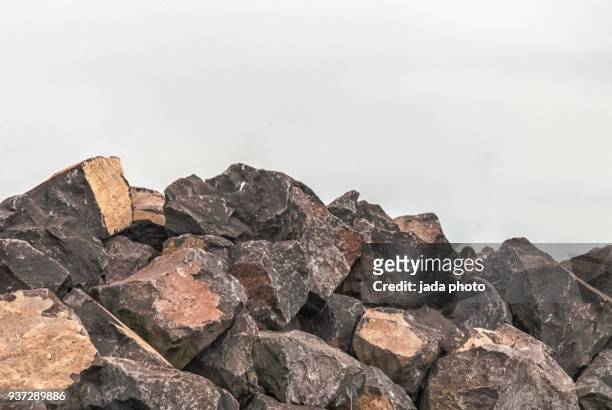 huge heap with boulders - rock stock pictures, royalty-free photos & images