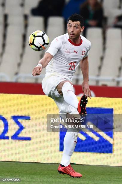 Switzerland's Berlim Dzemaili controls the ball during a friendly football match against Greece in Athens on March 23, 2018.