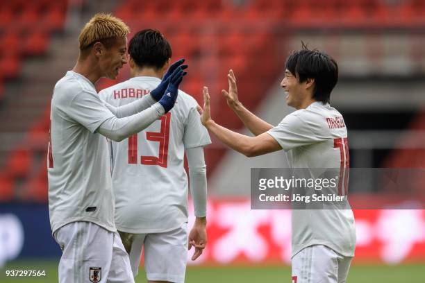L-r Keisuke Honda of Japan and Shoya Nakajima of Japan react after the equalizer during the International friendly match between Japan and Mali at...
