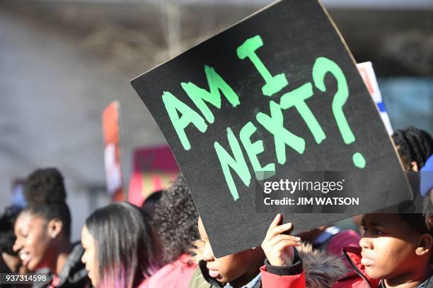 People arrive for the March For Our Lives rally against gun violence in Washington, DC on March 24, 2018. - Galvanized by a massacre at a Florida...