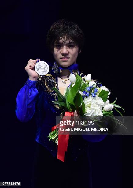 Silver medallist Japan's Shoma Uno poses on the podium of the Men-Free Skate program at the Milan World Figure Skating Championship 2018 on March 24,...