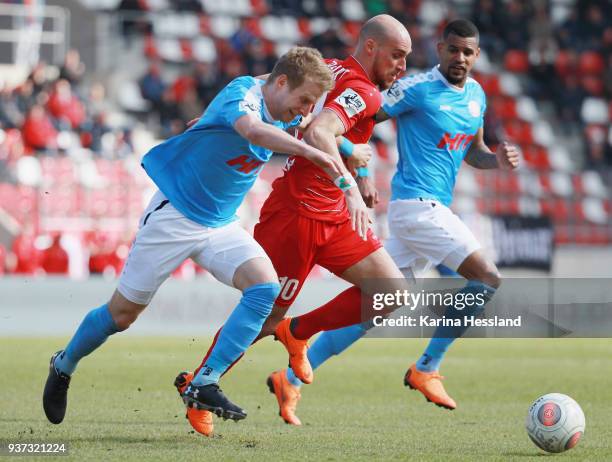 Daniel Brueckner of Erfurt is challenged by Dominik Ernst of Koeln during the third Liga match between FC Rot Weiss Erfurt and SC Fortuna Koeln at...