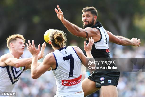 Paddy Ryder of Port Adelaide rucks the ball past Nat Fyfe of the Dockers during the round one AFL match between the Port Adelaide Power and the...