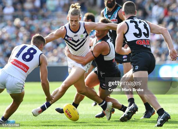 Nat Fyfe of the Dockers gets caught during the round one AFL match between the Port Adelaide Power and the Fremantle Dockers at Adelaide Oval on...