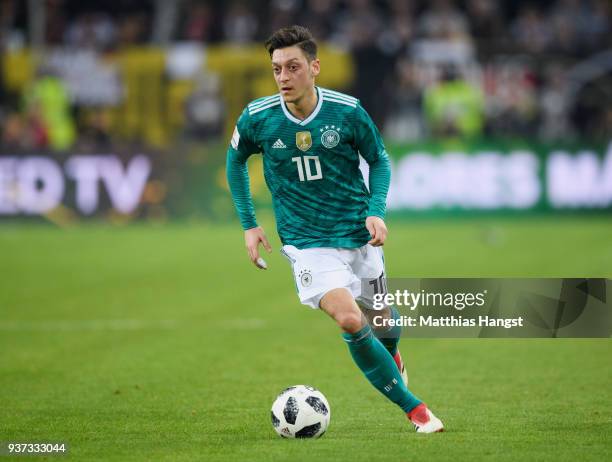 Mesut Oezil of Germany controls the ball during the international friendly match between Germany and Spain at Esprit-Arena on March 23, 2018 in...