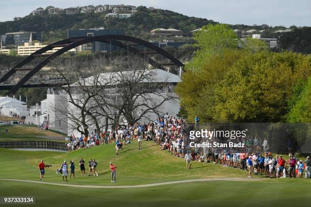 Fans watch Jordan Spieth play a shot on the 16th hole during round three of the World Golf Championships-Dell Technologies Match Play at Austin...