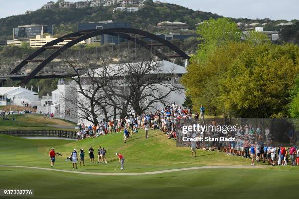 Fans watch Jordan Spieth play a shot on the 16th hole during round three of the World Golf Championships-Dell Technologies Match Play at Austin...