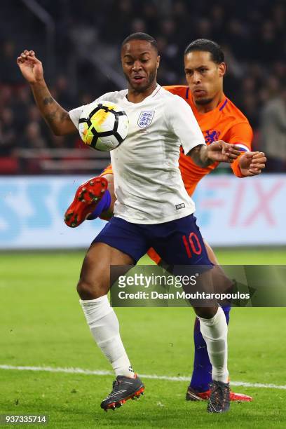 Raheem Sterling of England battles for the ball with Virgil van Dijk of the Netherlands during the International Friendly match between Netherlands...