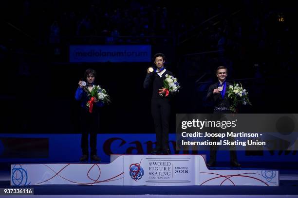 Shoma Uno of Japan, Nathan Chen of the United States and Mikhail Kolyada of Russia pose in the Men's medal ceremony during day four of the World...