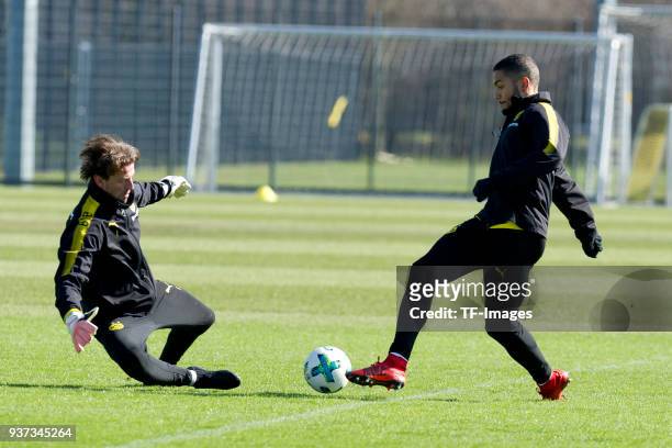 Goalkeeper Roman Weidenfeller and Jeremy Toljan of Dortmund battle for the ball during a training session at BVB trainings center on March 20, 2018...