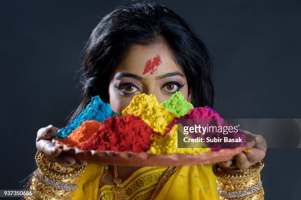 indian woman celebrating holi. - subir basak stockfoto's en -beelden