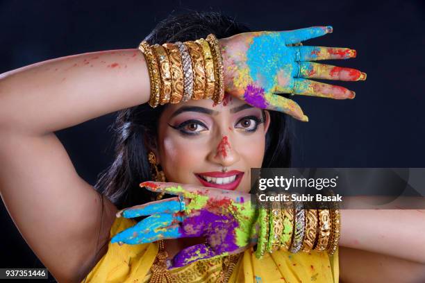 indian woman celebrating holi. - subir basak stockfoto's en -beelden