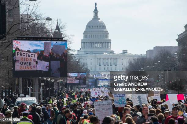 Participants take part in the March for Our Lives Rally in Washington, DC on March 24, 2018. Bundled against the cold but fired up with passion after...