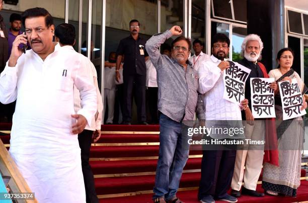 Leaders protested and demanded arrest of Manohar Bhide also seen Prithivraj Chavan during the budget session at Vidhan Bhavan, on March 23, 2018 in...