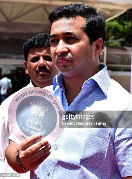 Nitesh Rane shows the duplicate sticker made for MLAs vehicle which is used by illegal people during the budget session at Vidhan Bhavan, on March...
