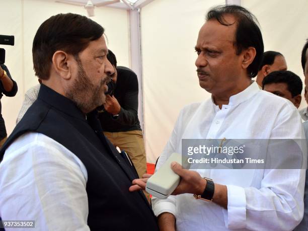 Girish Bapat interacts with Ajit Pawar during the budget session at Vidhan Bhavan, on March 23, 2018 in Mumbai, India.