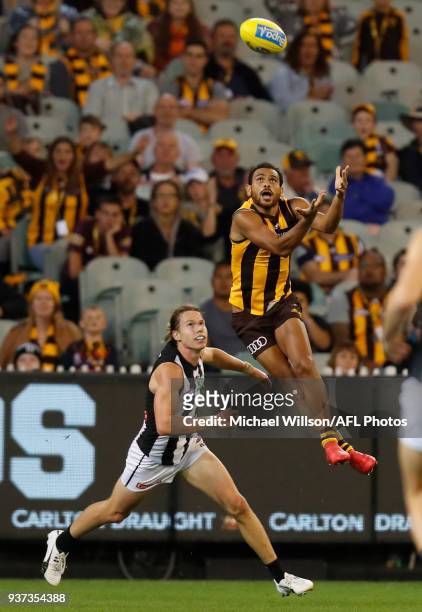 Cyril Rioli of the Hawks and Tom Langdon of the Magpies in action during the 2018 AFL round 01 match between the Hawthorn Hawks and the Collingwood...