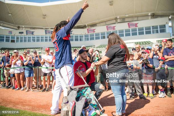 Hanley Ramirez of the Boston Red Sox participates in a marriage proposal for fans during a team workout on March 24, 2018 at Fenway South in Fort...