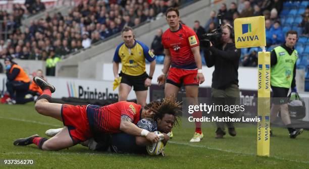 Marland Yarde of Sale Sharks holds off Bryce Heem of Worcester Warriors to score a try during the Aviva Premiership match between Sale Sharks and...