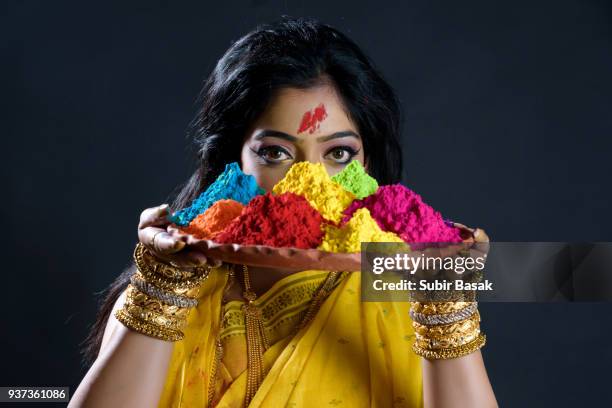 indian woman celebrating holi. - subir basak stockfoto's en -beelden