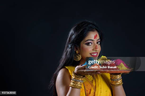 indian woman celebrating holi. - subir basak stockfoto's en -beelden