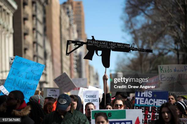 Protestors attend the March For Our Lives just north of Columbus Circle, March 24, 2018 in New York City. Thousands of demonstrators, including...