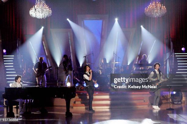 Episode 602A - Accompanied by professional dancers Louis van Amstel and Cheryl Burke, the chart-topping Jonas Brothers were featured as musical...