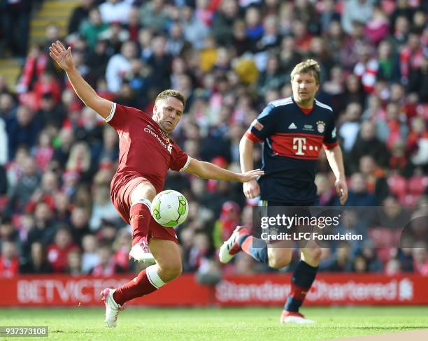 Michael Owen of Liverpool with Michael Tarnat of Bayern Munich during the LFC Foundation charity match between Liverpool FC Legends and FC Bayern...