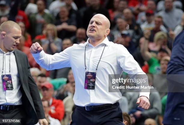 Head coach Cael Sanderson of the Penn State Nittany Lions celebrates after Bo Nickal won the 184 pound championship match and clinched the team title...
