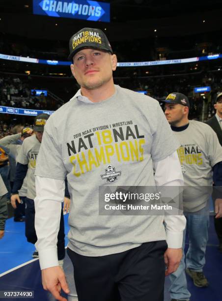 Head coach Cael Sanderson of the Penn State Nittany Lions wears team national champion apparel during the awards ceremony of the NCAA Photos via...