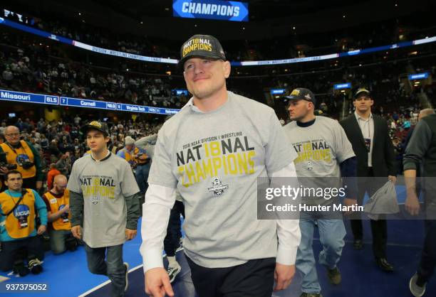 Head coach Cael Sanderson of the Penn State Nittany Lions smiles as he wears team national champion apparel during the awards ceremony of the NCAA...