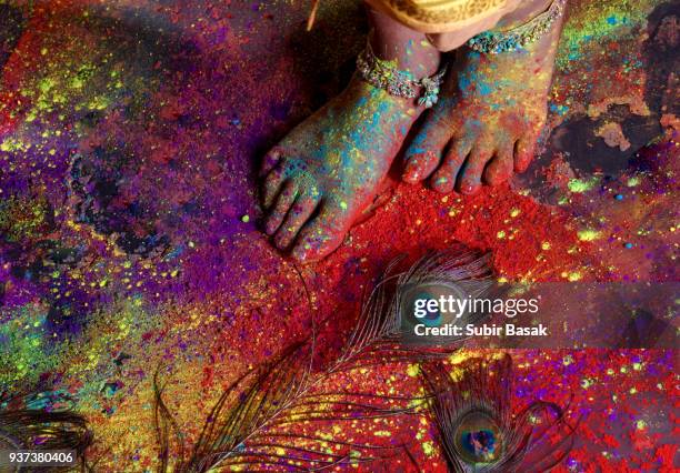 an indian woman celebrating holi festival. - indian female feet stock pictures, royalty-free photos & images