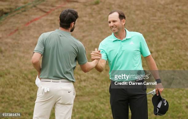 Kyle Stanley of the United States shakes hands with Sergio Garcia of Spain after defeating him 3&1 on the 17th green during the fourth round of the...